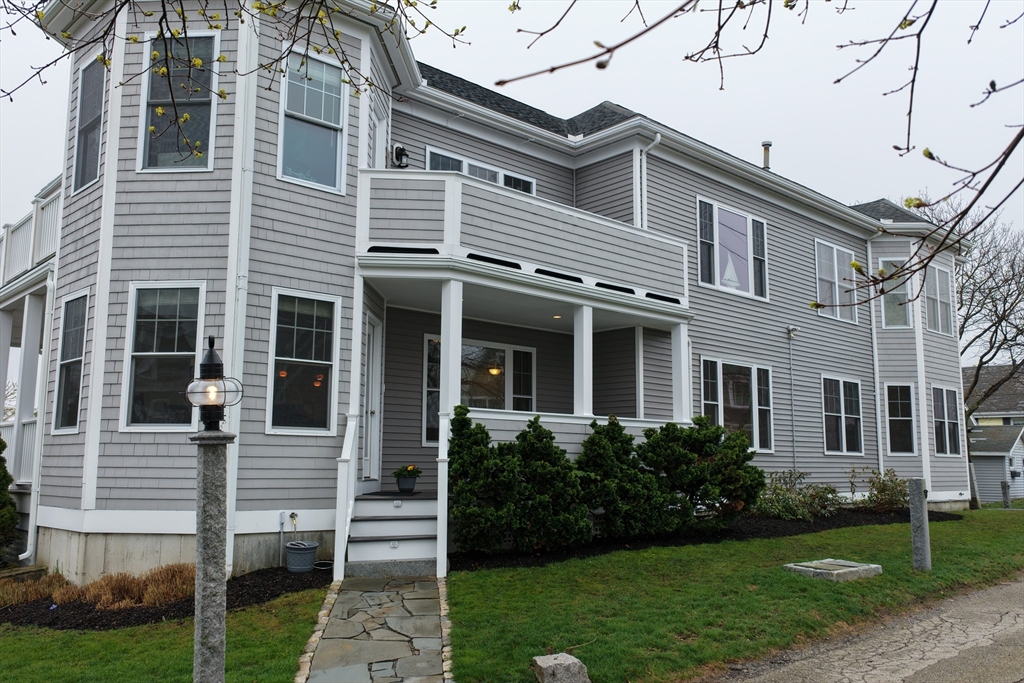 9 Meade Avenue, Unit 1 Hull, MA 02045 - Photo 34 of 34 a front view of a house with a yard