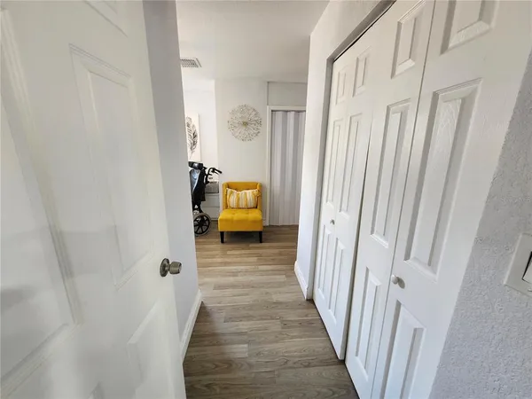 a view of a bedroom from a hallway