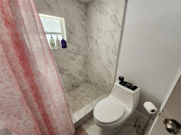 a bathroom with a toilet and a sink