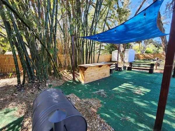a view of a backyard with a sitting area