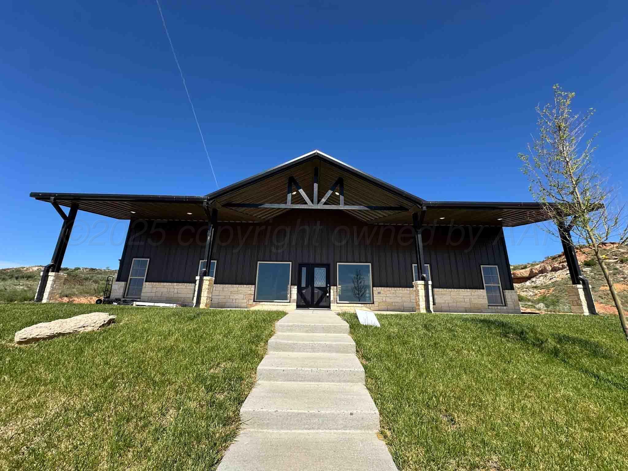 a front view of a house with a yard