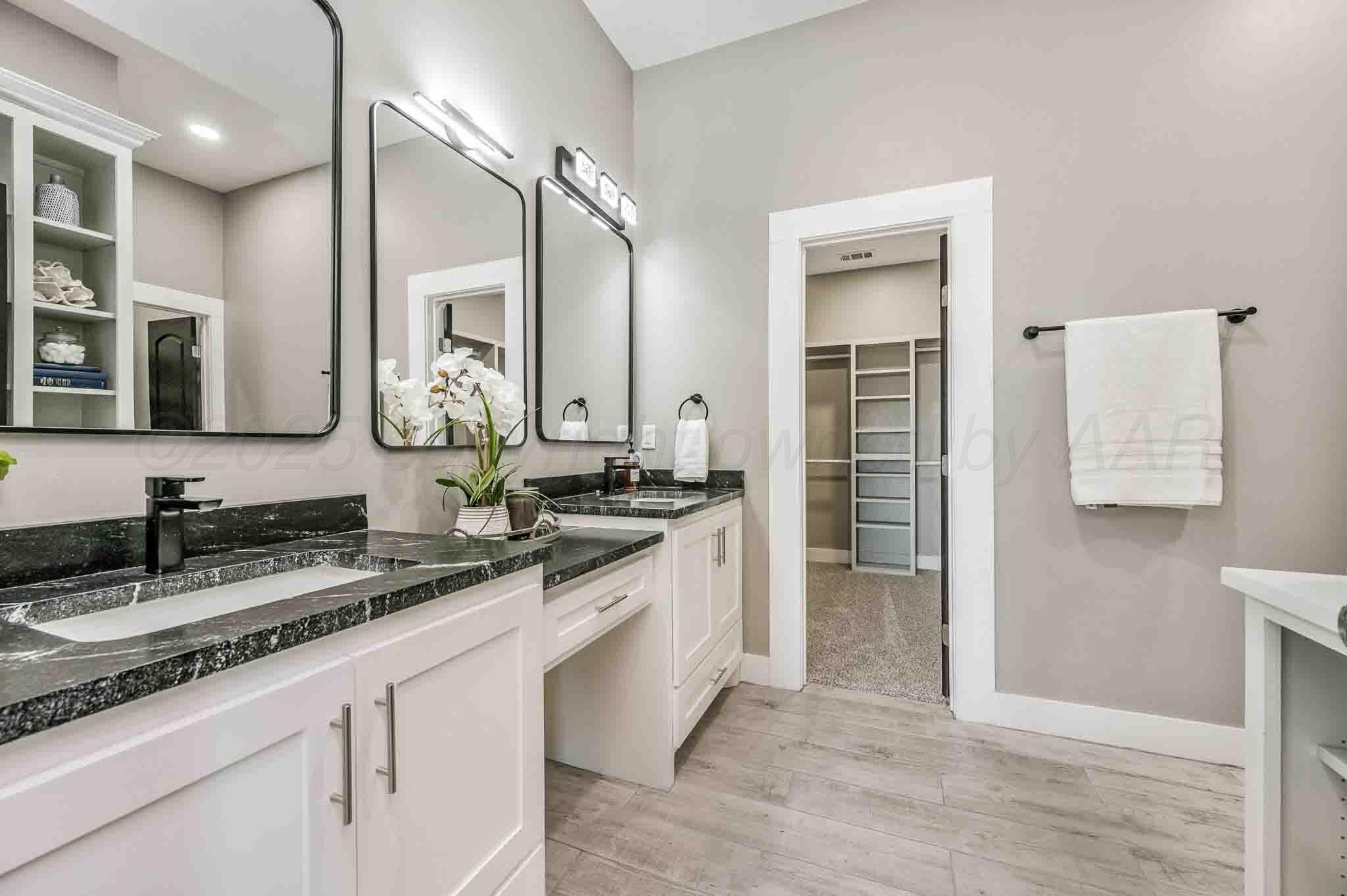 18501 Gold Road Amarillo, TX 79124 - Photo 16 of 48 a bathroom with a granite countertop sink and a mirror