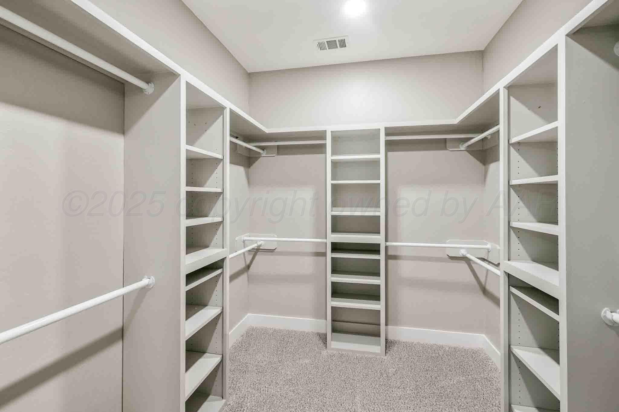 18501 Gold Road Amarillo, TX 79124 - Photo 18 of 48 a view of walk in closet with empty racks