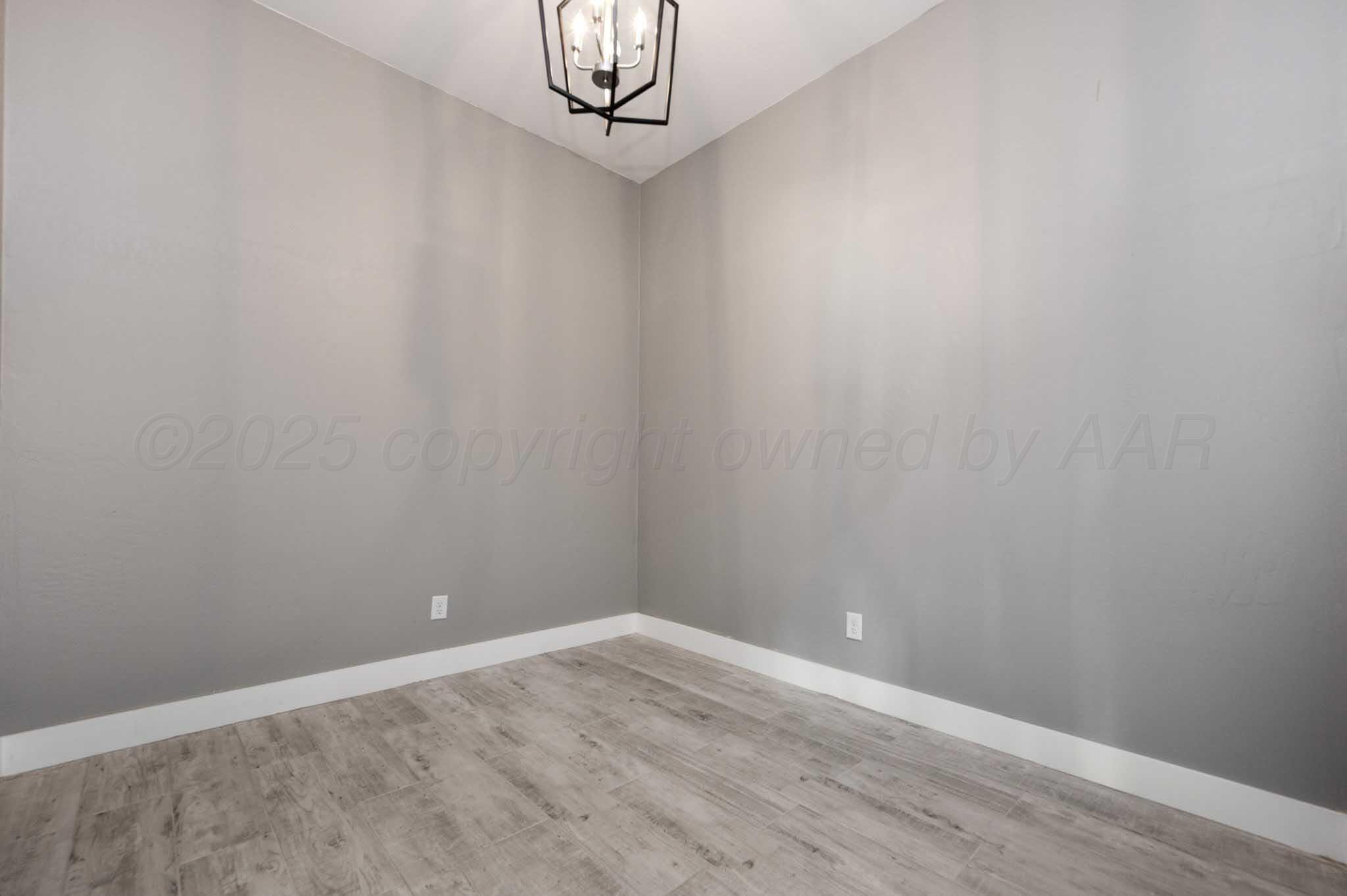 18501 Gold Road Amarillo, TX 79124 - Photo 27 of 48 a view of an empty room with wooden floor