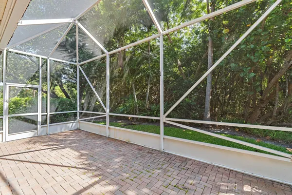 a view of a kitchen with a large window and furniture