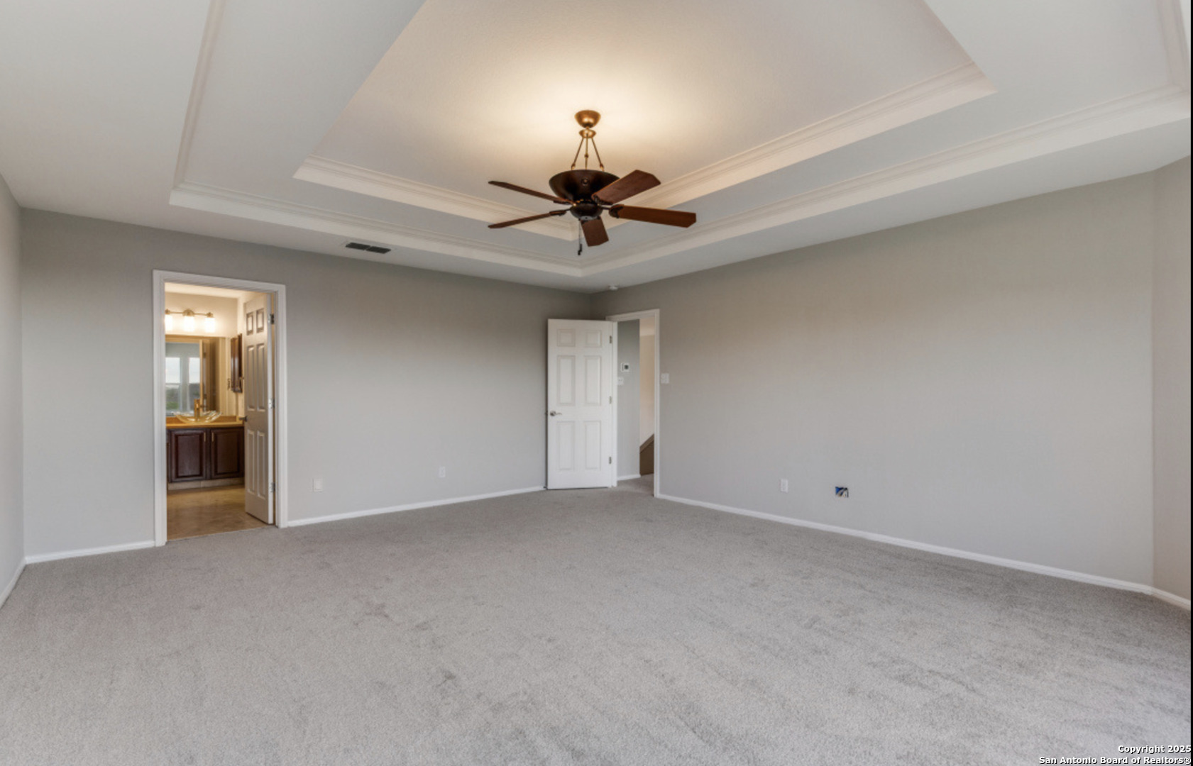19431 Camino Ridge San Antonio, TX 78258 - Photo 4 of 25 a view of an empty room and a chandelier fan
