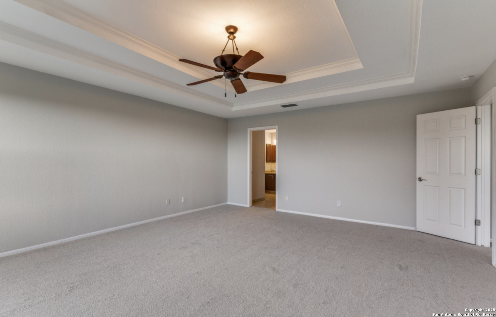 19431 Camino Ridge San Antonio, TX 78258 - Photo 5 of 25 a view of an empty room and a chandelier fan