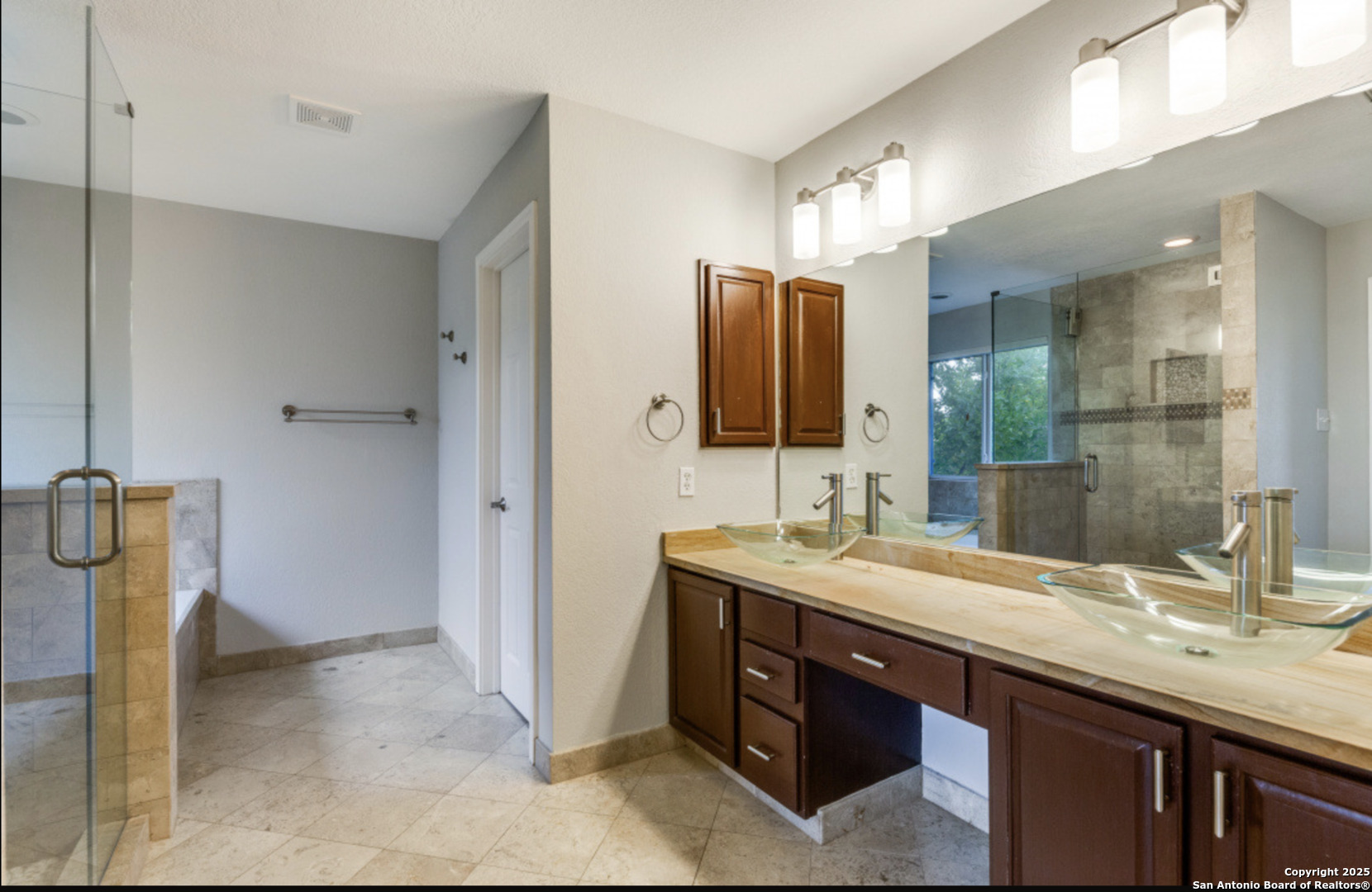 19431 Camino Ridge San Antonio, TX 78258 - Photo 7 of 25 a bathroom with a granite countertop sink and a mirror