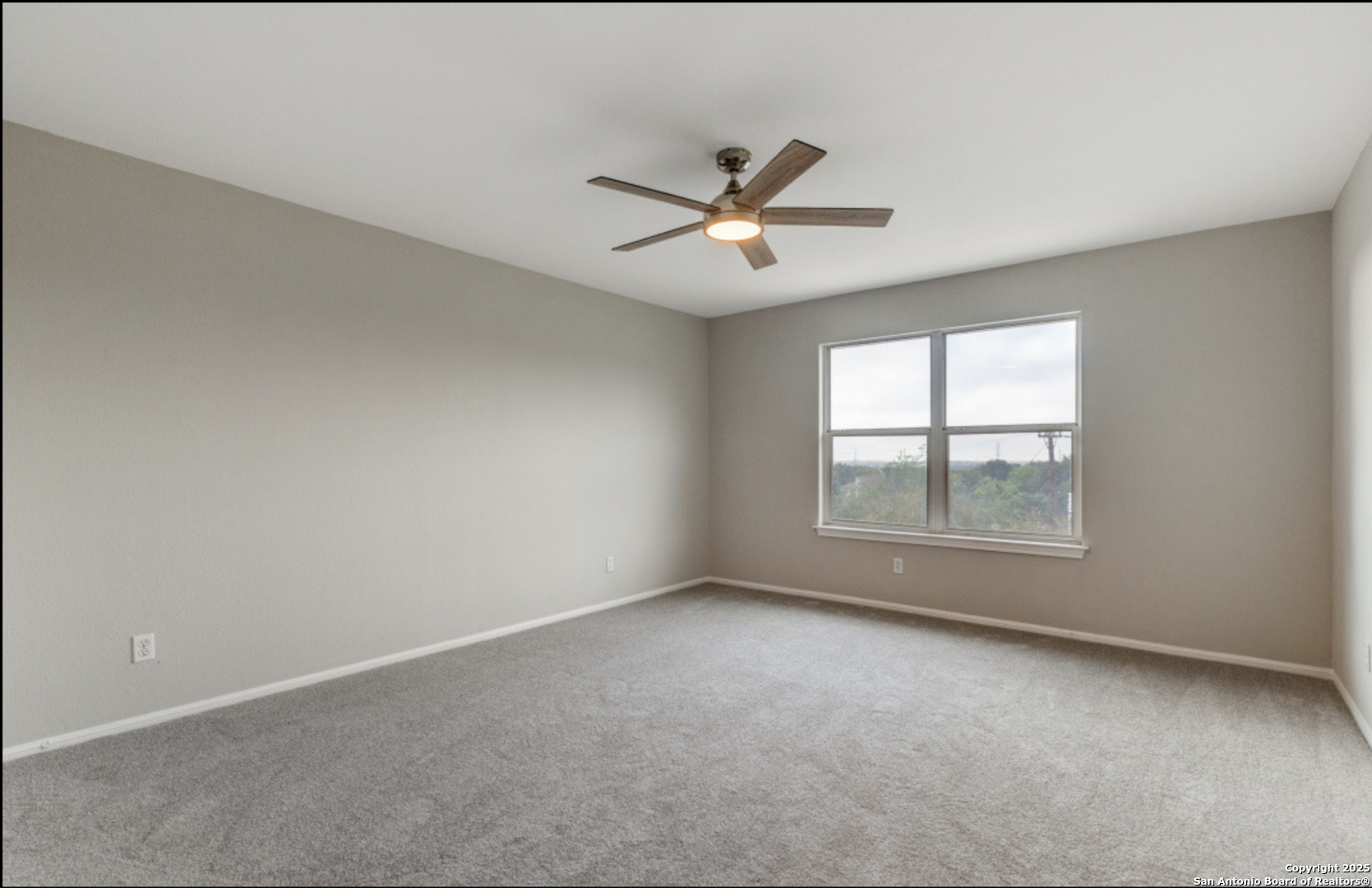 19431 Camino Ridge San Antonio, TX 78258 - Photo 9 of 25 wooden floor in an empty room with a window