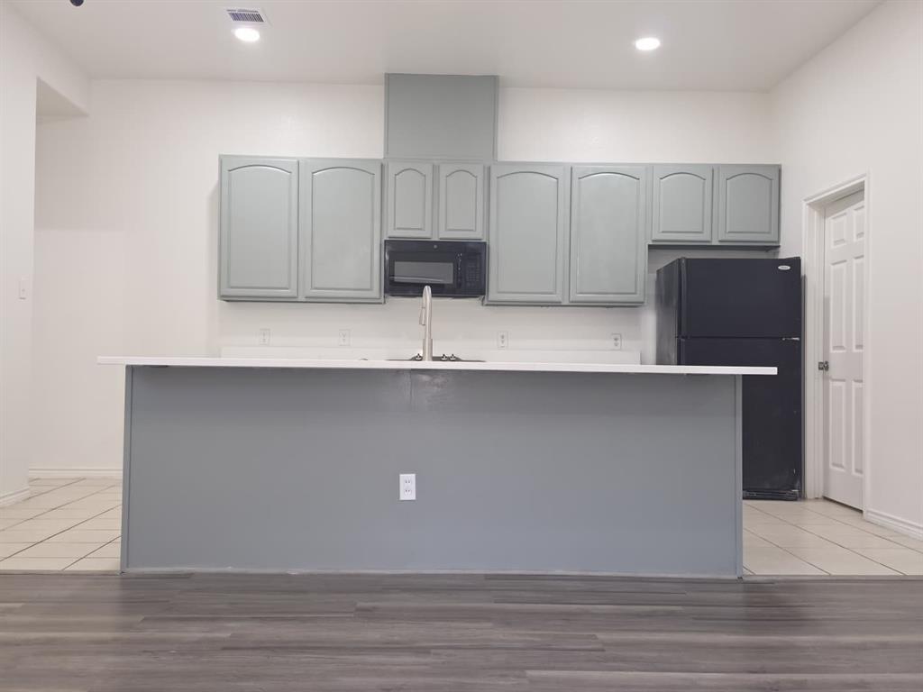 8047 New Kent Road Frisco, TX 75035 - Photo 11 of 27 Kitchen featuring light gray cabinetry, white countertops, stainless steel sink with faucet, built-in microwave, and recessed lighting