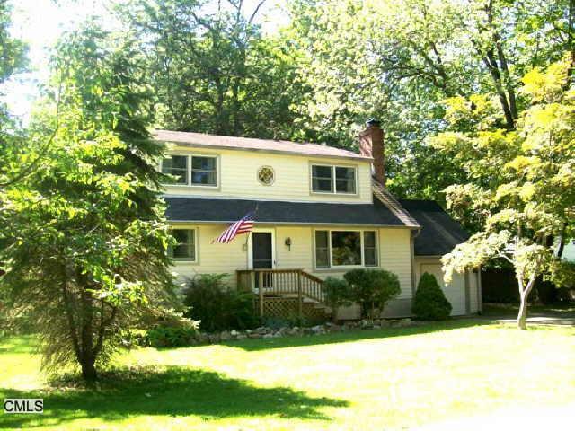 366 Bennetts Farm Road Ridgefield, CT 06877 - Photo 1 of 1 a front view of a house with a yard