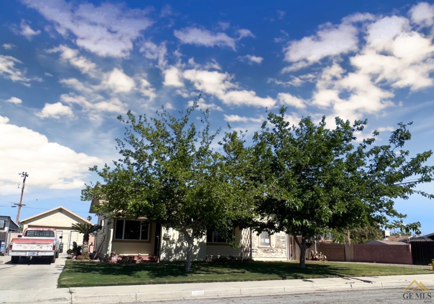 Undisclosed Address Taft, CA 93268 - Photo 1 of 9 a front view of a house with garden