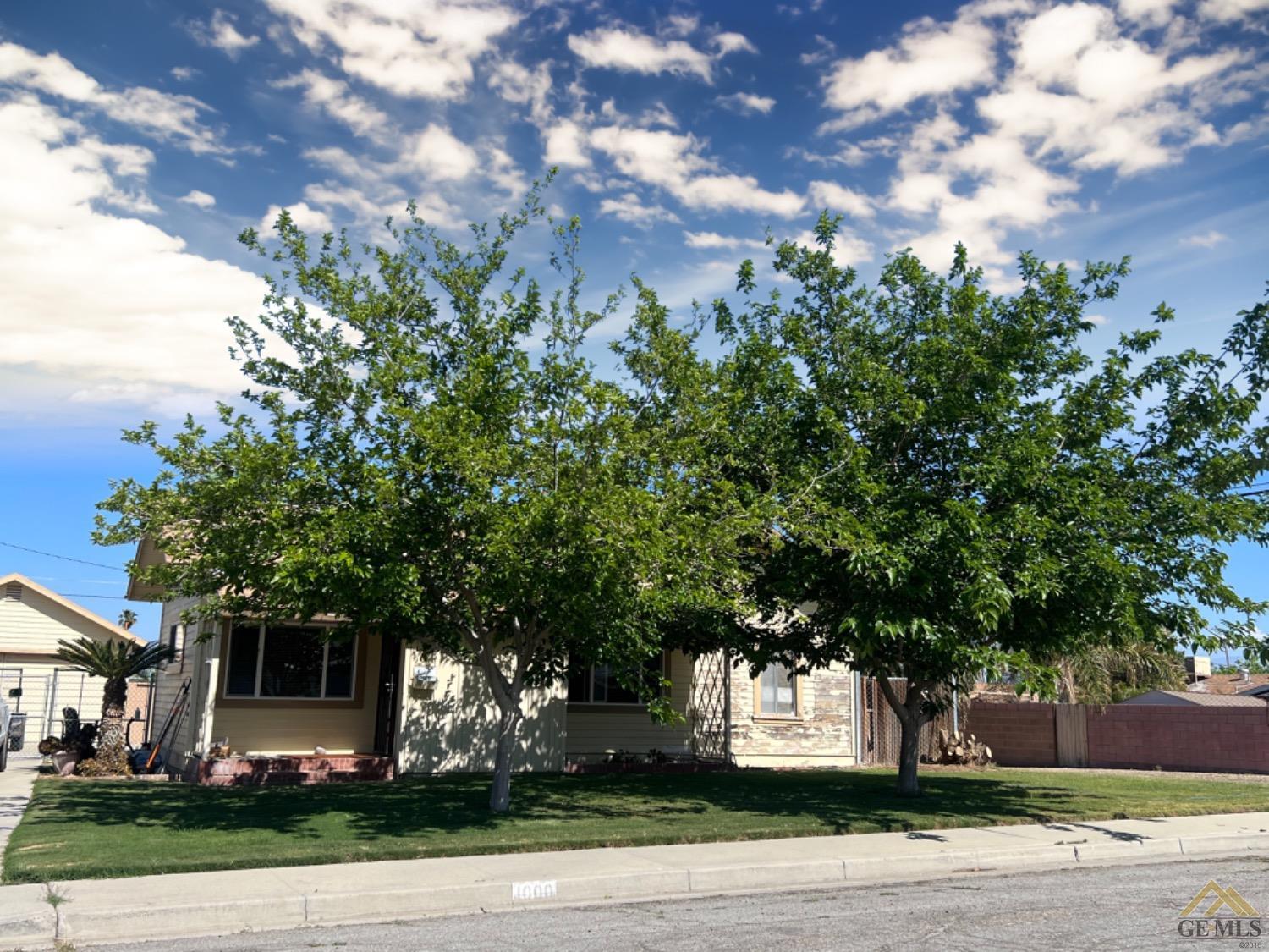 Undisclosed Address Taft, CA 93268 - Photo 3 of 9 a front view of a house with a tree