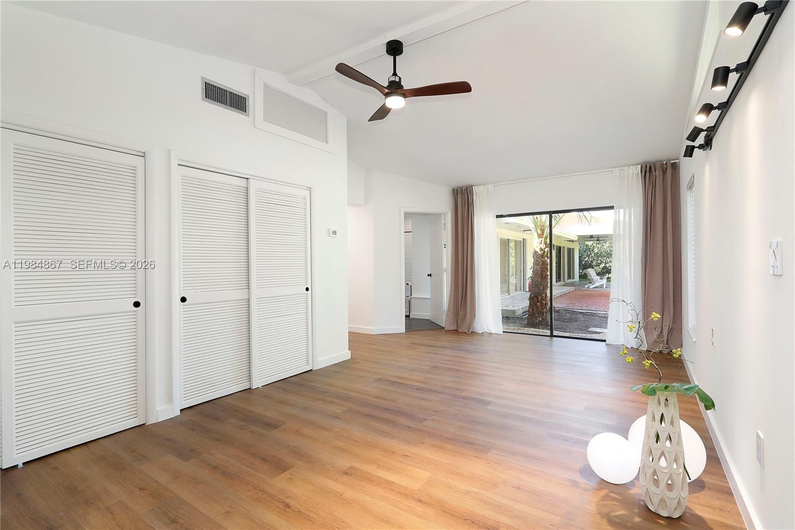 6841 Southwest 130th Terrace Pinecrest, FL 33156 - Photo 13 of 19 Master with ample closets and en-suite bath overlooking the garden