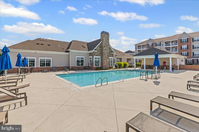 a view of a kitchen with a sink and dishwasher wooden floor