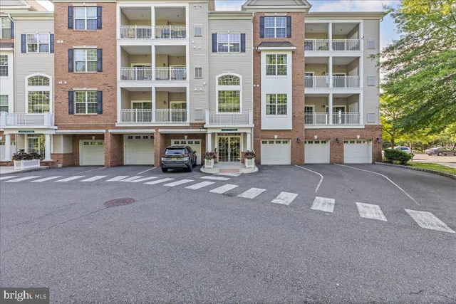 a front view of a building with a street