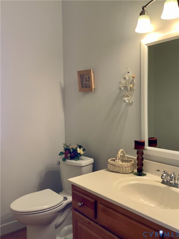 15801 Hampton Summit Lane Chesterfield, VA 23832 - Photo 15 of 42 a bathroom with a sink a toilet and a mirror