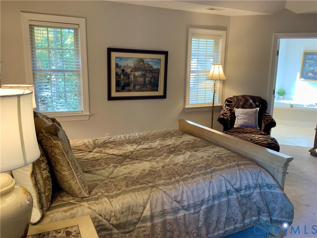 15801 Hampton Summit Lane Chesterfield, VA 23832 - Photo 21 of 42 a bedroom with a bed and wooden floor