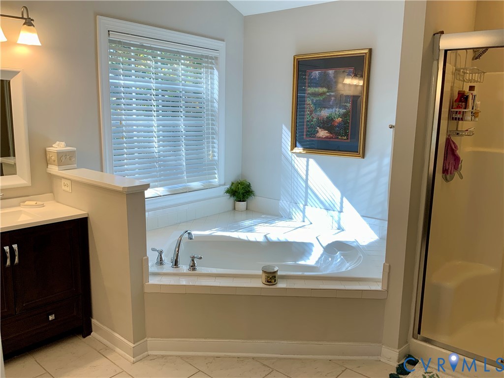 15801 Hampton Summit Lane Chesterfield, VA 23832 - Photo 23 of 42 a view of a living room with a fireplace and a window