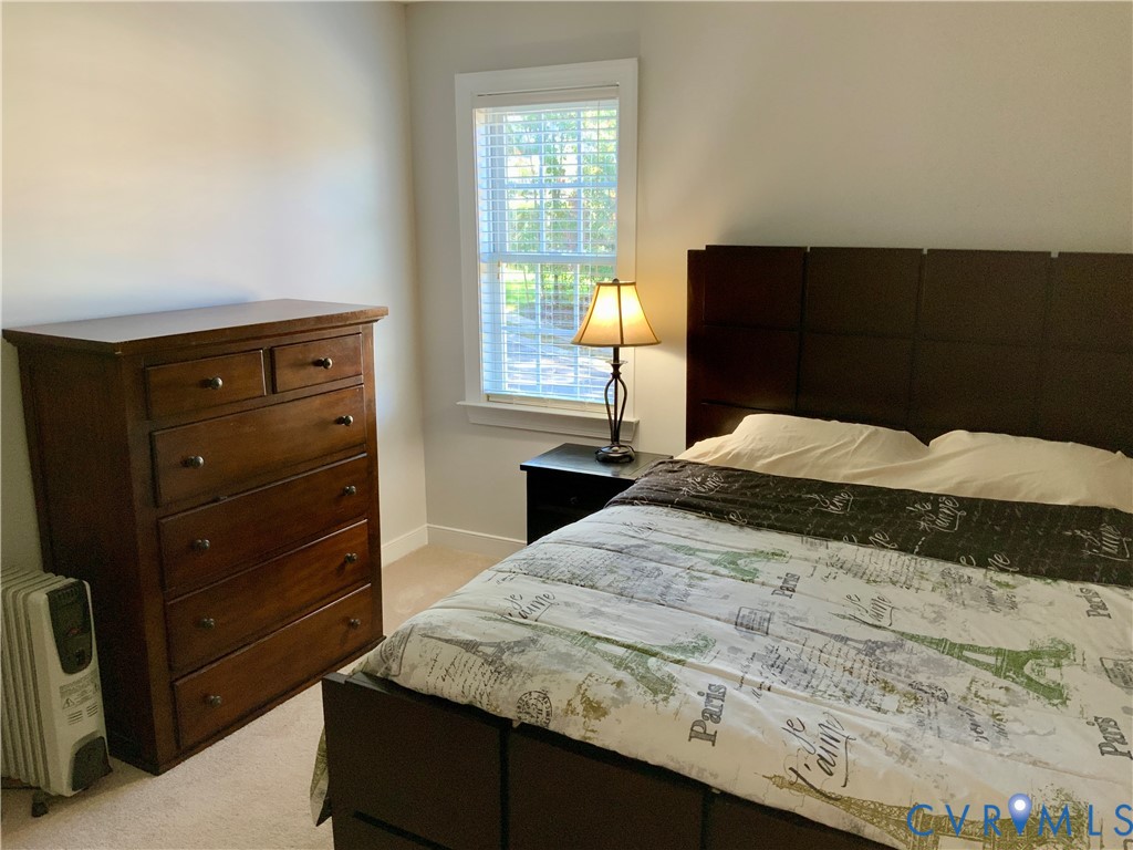 15801 Hampton Summit Lane Chesterfield, VA 23832 - Photo 29 of 42 a bedroom with a bed and a dresser