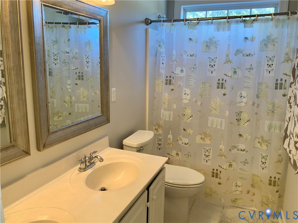 15801 Hampton Summit Lane Chesterfield, VA 23832 - Photo 36 of 42 a bathroom with a sink toilet and shower