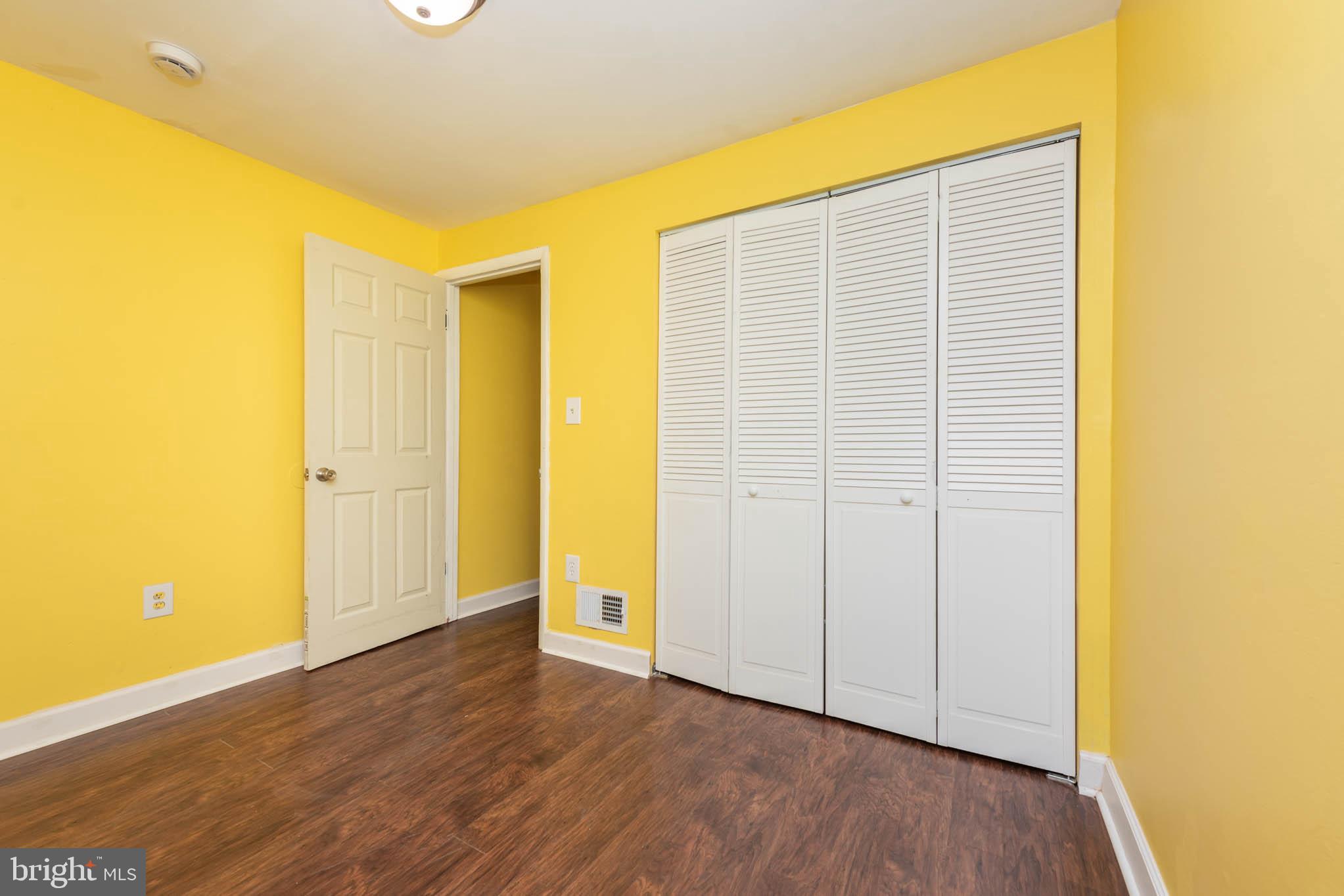 1737 North Dallas Street Baltimore, MD 21213 - Photo 11 of 14 a view of an empty room with wooden floor and a window