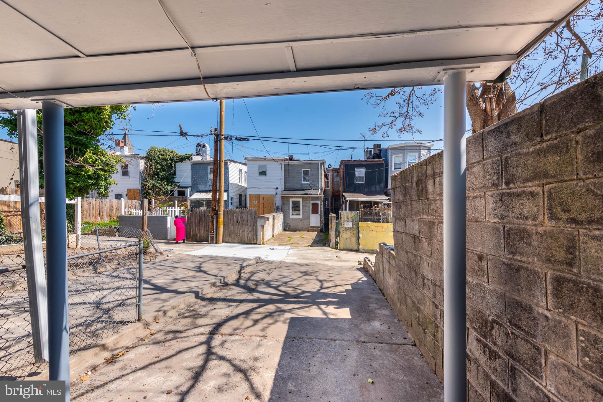 1737 North Dallas Street Baltimore, MD 21213 - Photo 14 of 14 a view of a patio with a table and chairs