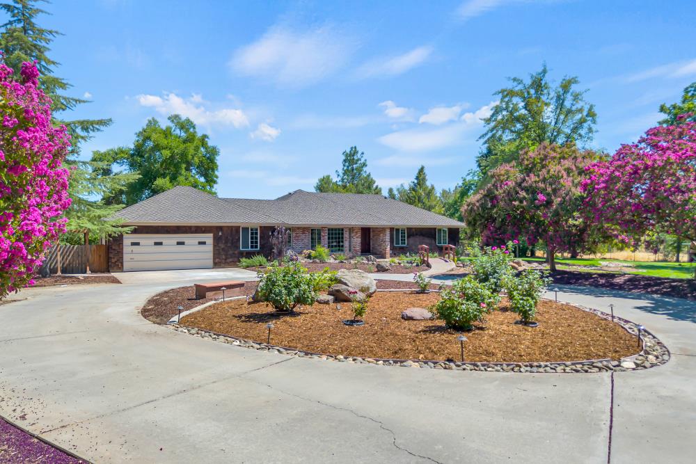 9257 Tavernor Road Wilton, CA 95693 - Photo 1 of 1 a front view of a house with a yard
