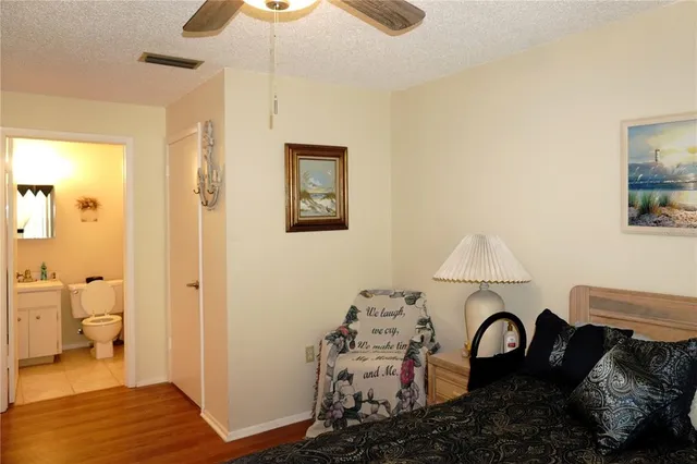 a bed room with a bed and a lamp