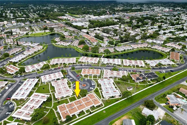 an aerial view of residential houses with outdoor space