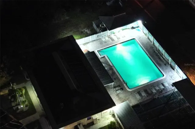 a living room with a chair and fireplace