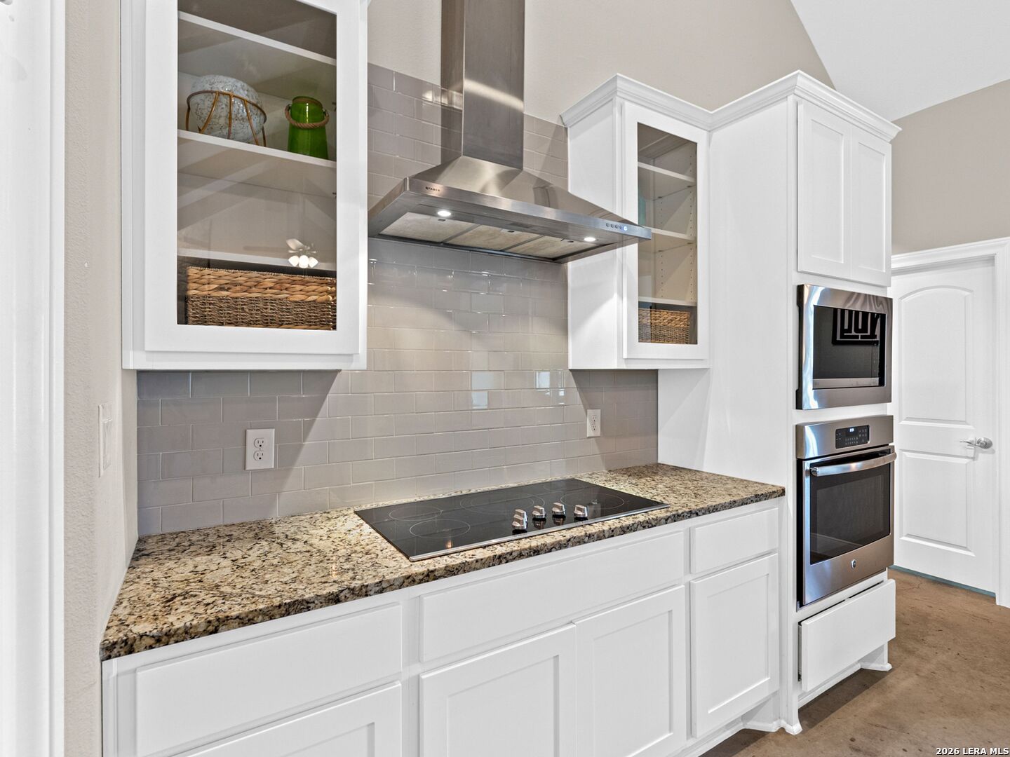1025 Deep Water Drive Spring Branch, TX 78070 - Photo 11 of 55 a kitchen with stainless steel appliances granite countertop a sink stove and refrigerator
