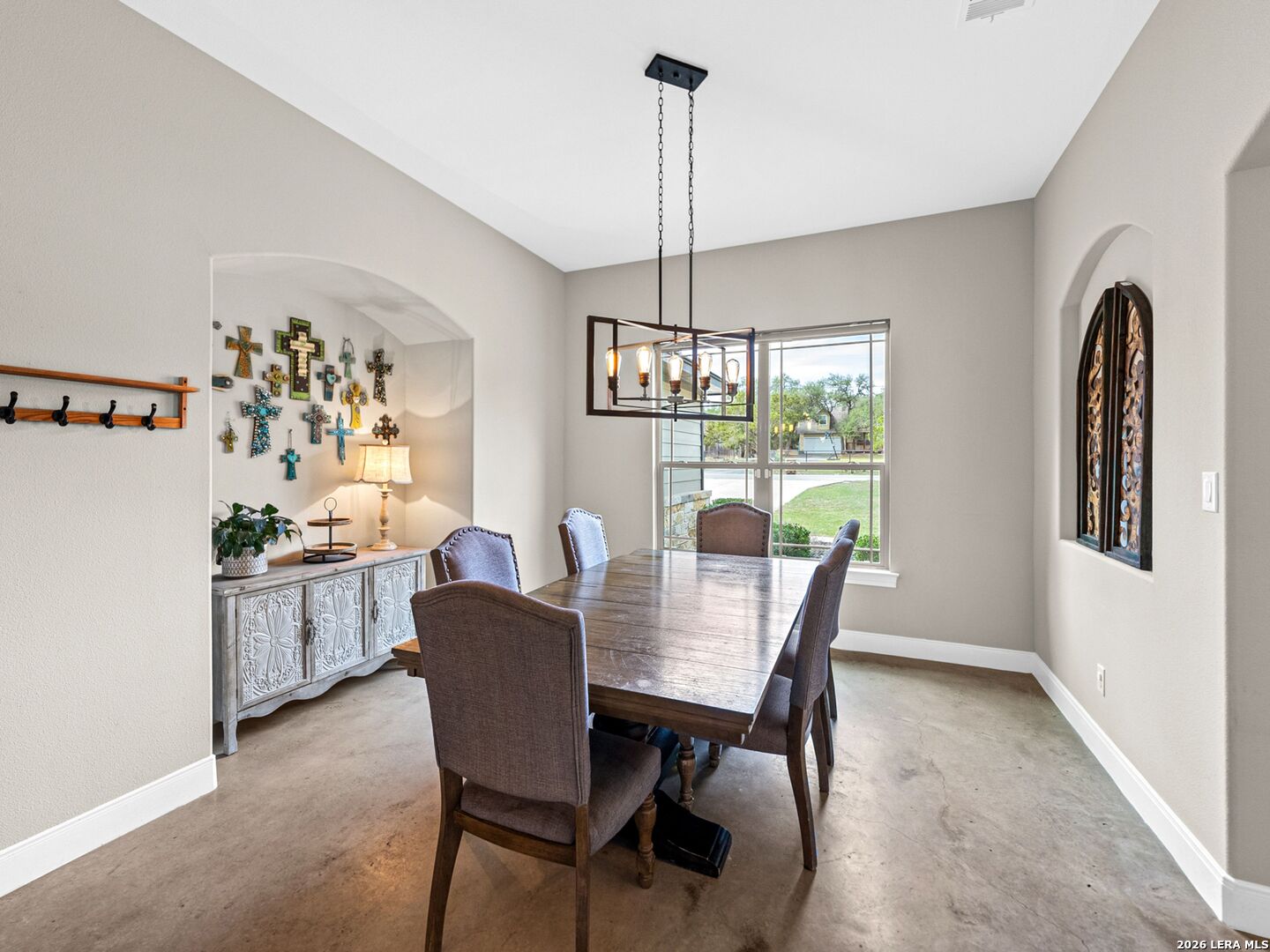 1025 Deep Water Drive Spring Branch, TX 78070 - Photo 12 of 55 a dining room with furniture a chandelier and window
