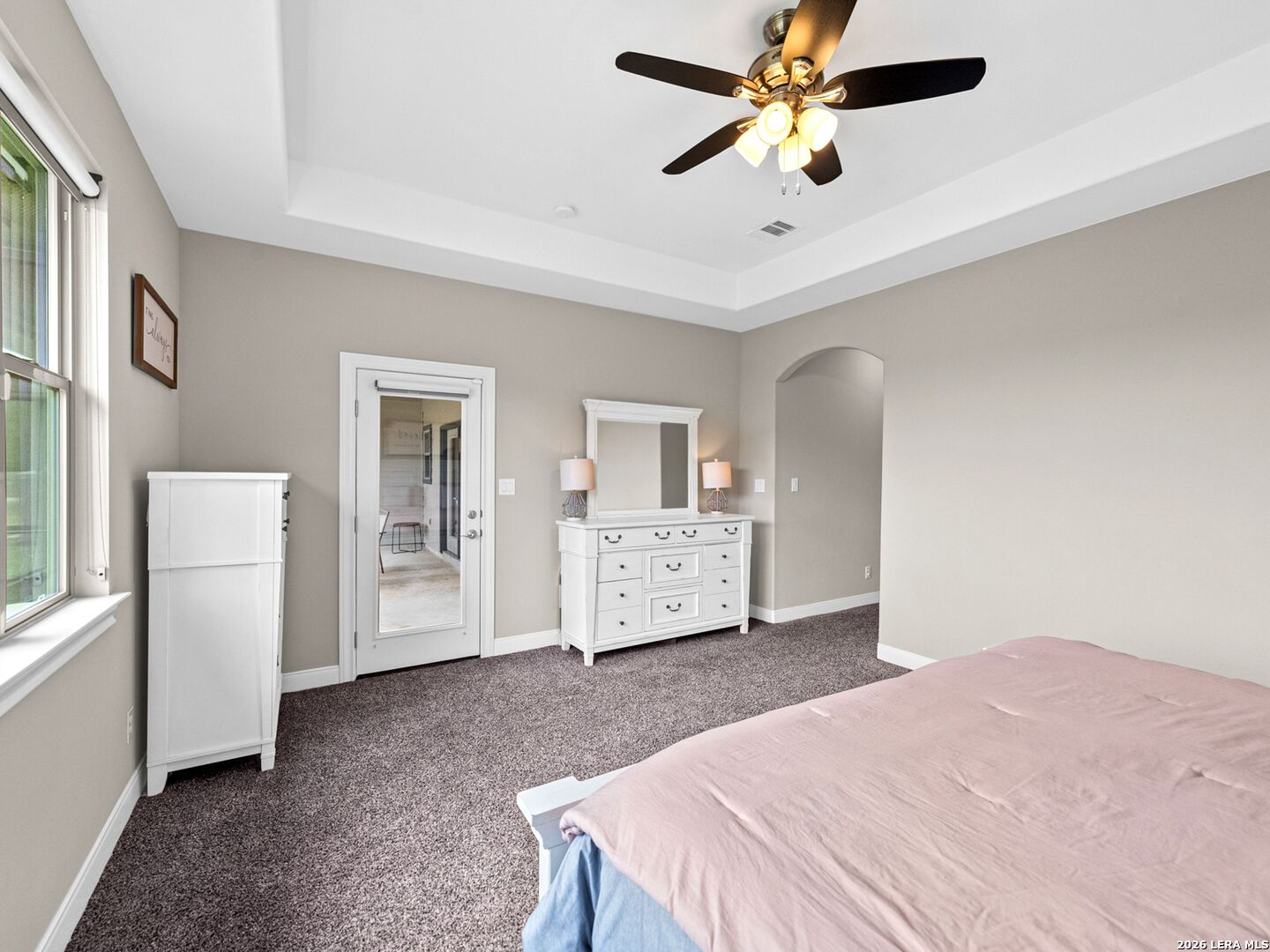 1025 Deep Water Drive Spring Branch, TX 78070 - Photo 15 of 55 a bedroom with a large bed a flat tv screen and dresser