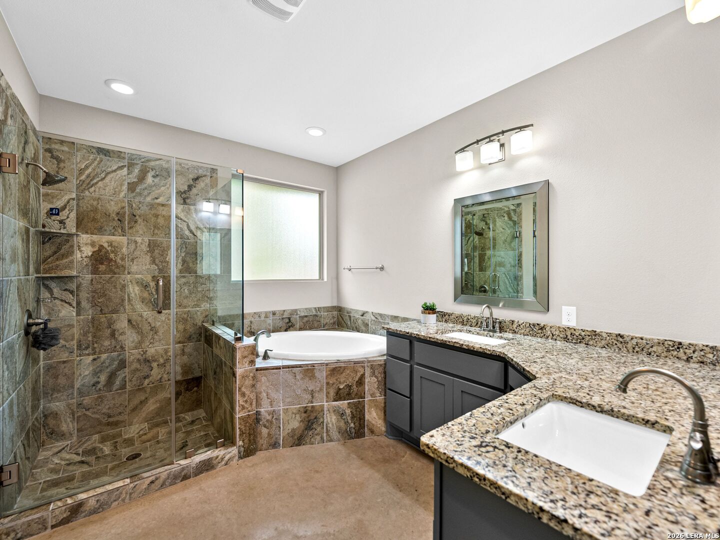 1025 Deep Water Drive Spring Branch, TX 78070 - Photo 16 of 55 a bathroom with a granite countertop sink mirror and double