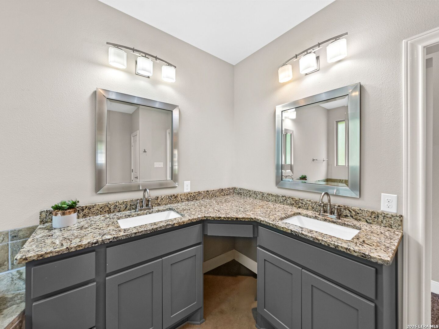 1025 Deep Water Drive Spring Branch, TX 78070 - Photo 17 of 55 a bathroom with a granite countertop sink double and mirror