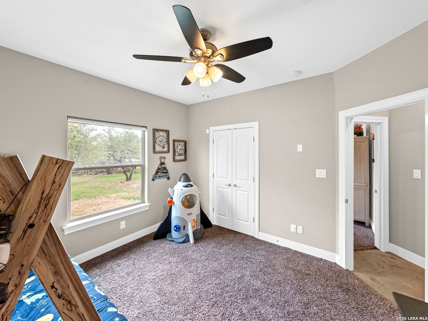 1025 Deep Water Drive Spring Branch, TX 78070 - Photo 27 of 55 a view of a livingroom with a window and a ceiling fan