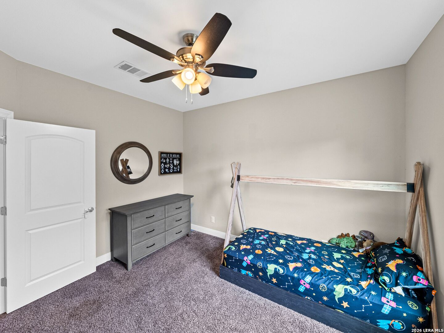 1025 Deep Water Drive Spring Branch, TX 78070 - Photo 28 of 55 a living room with furniture and a chandelier