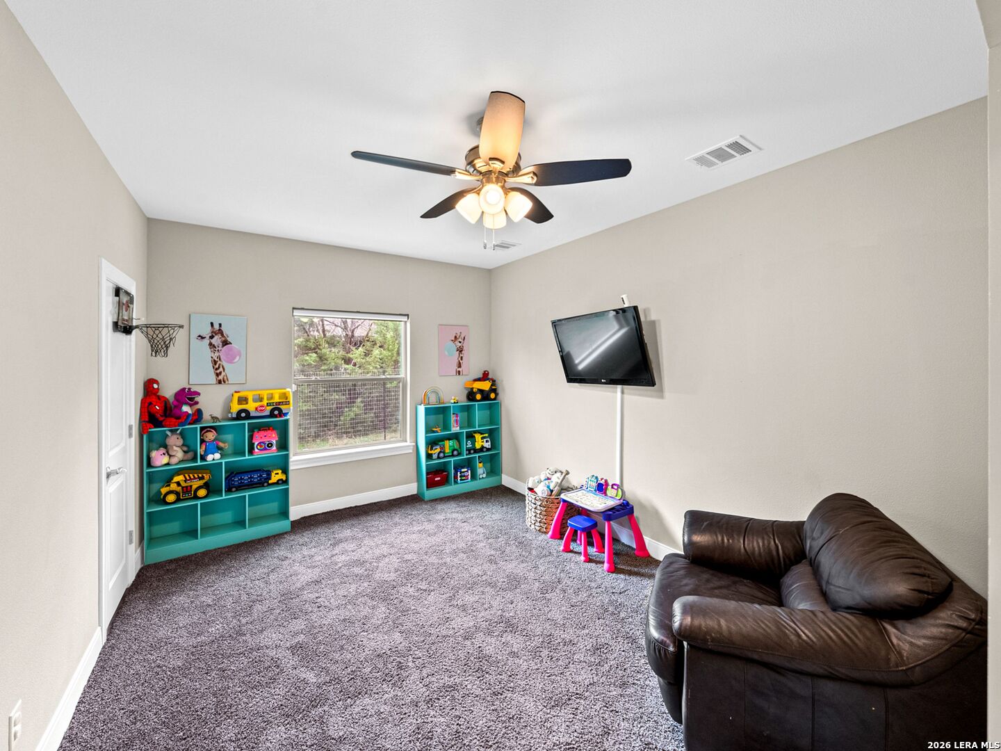 1025 Deep Water Drive Spring Branch, TX 78070 - Photo 29 of 55 a living room with furniture and a flat screen tv