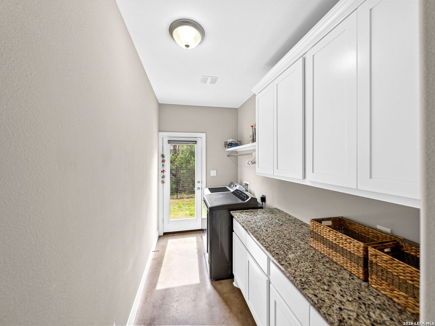 1025 Deep Water Drive Spring Branch, TX 78070 - Photo 35 of 55 a kitchen with a stove top oven a sink a counter space and cabinets