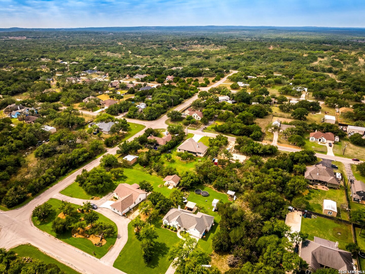 1025 Deep Water Drive Spring Branch, TX 78070 - Photo 47 of 55 an aerial view of residential houses with outdoor space
