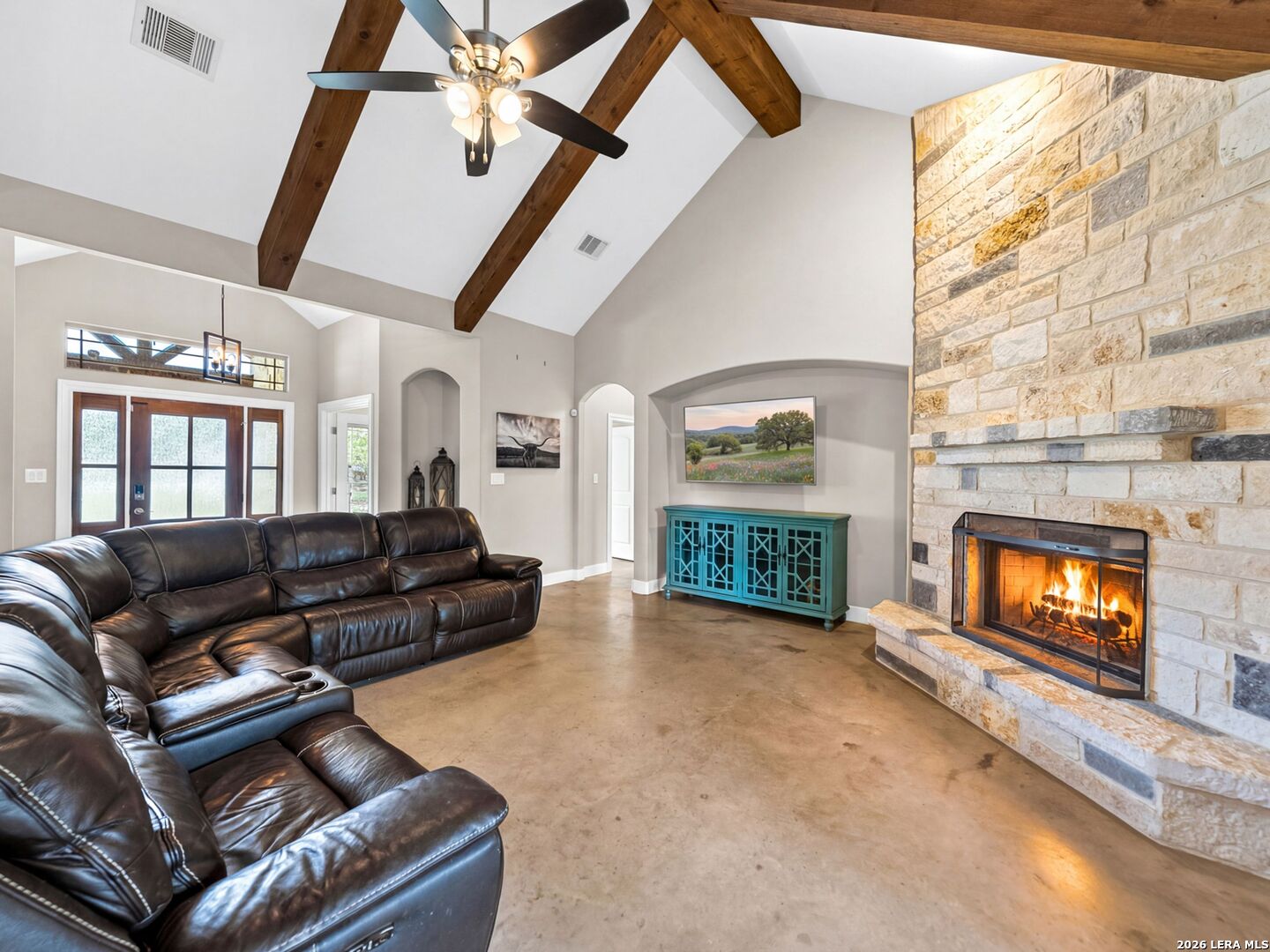 1025 Deep Water Drive Spring Branch, TX 78070 - Photo 5 of 55 a living room with furniture and a fireplace