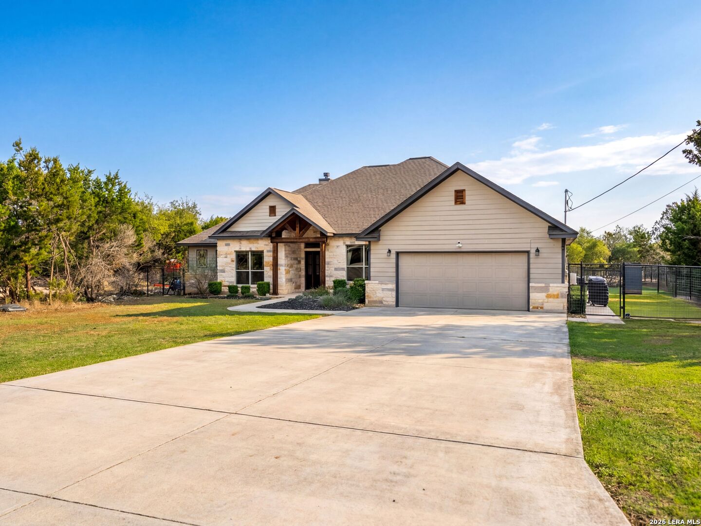 1025 Deep Water Drive Spring Branch, TX 78070 - Photo 55 of 55 a front view of house with yard and car parked