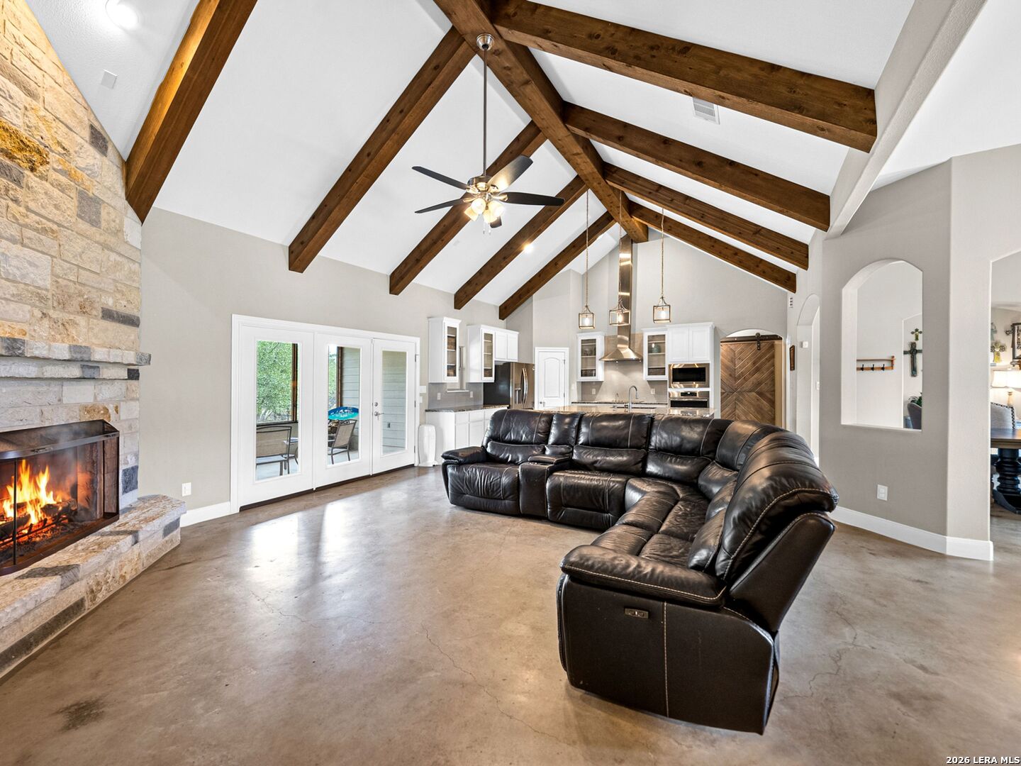 1025 Deep Water Drive Spring Branch, TX 78070 - Photo 8 of 55 a living room with furniture and a fireplace