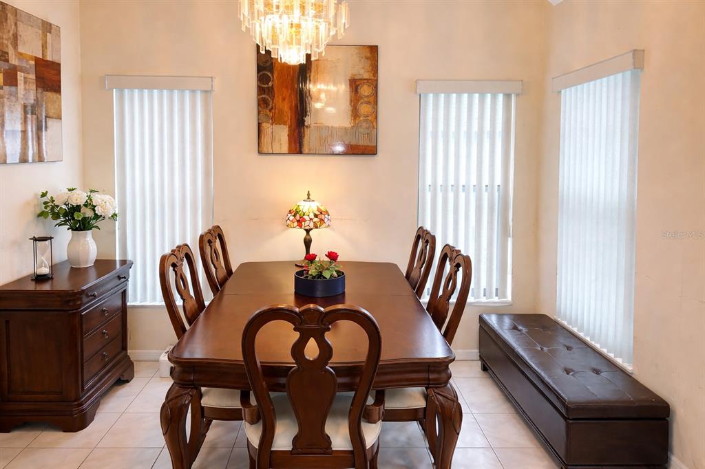 3637 Downfield Place, Unit 402 New Port Richey, FL 34655 - Photo 18 of 39 a dining room with furniture and window