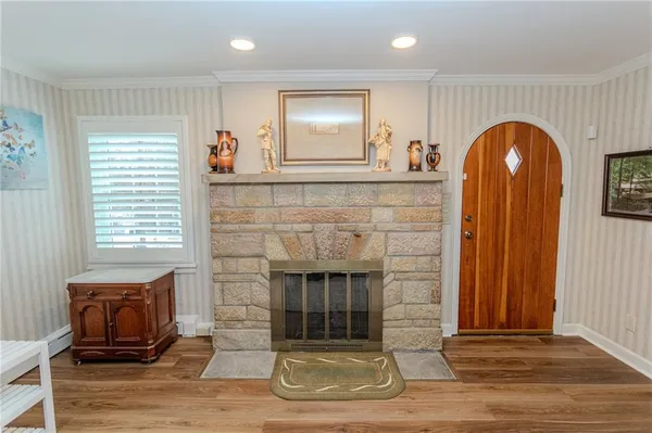 a dining room with furniture window and wooden floor