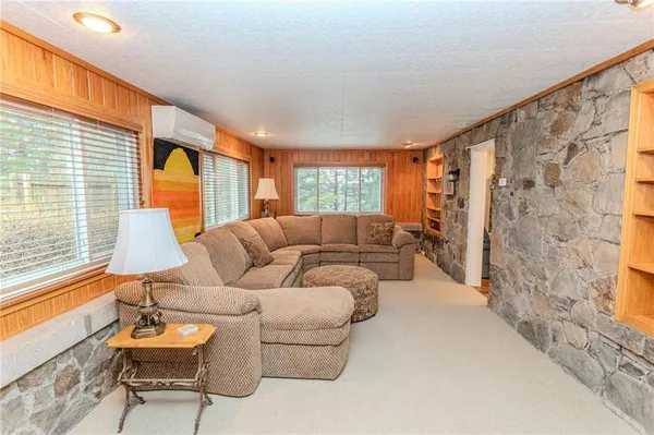 a living room with a couch and a large window