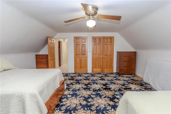 a bedroom with a bed and a cabinets