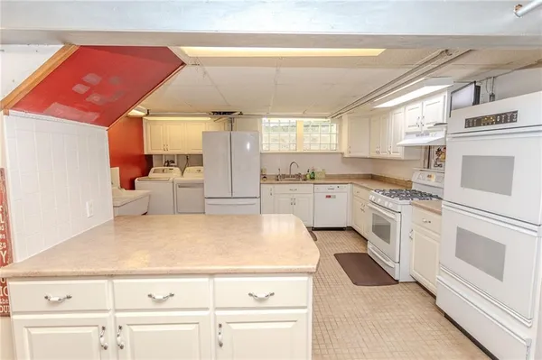 a utility room with dryer and washer