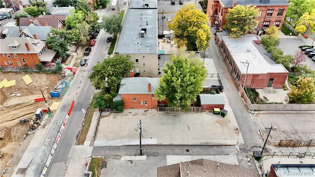an aerial view of a house with outdoor space